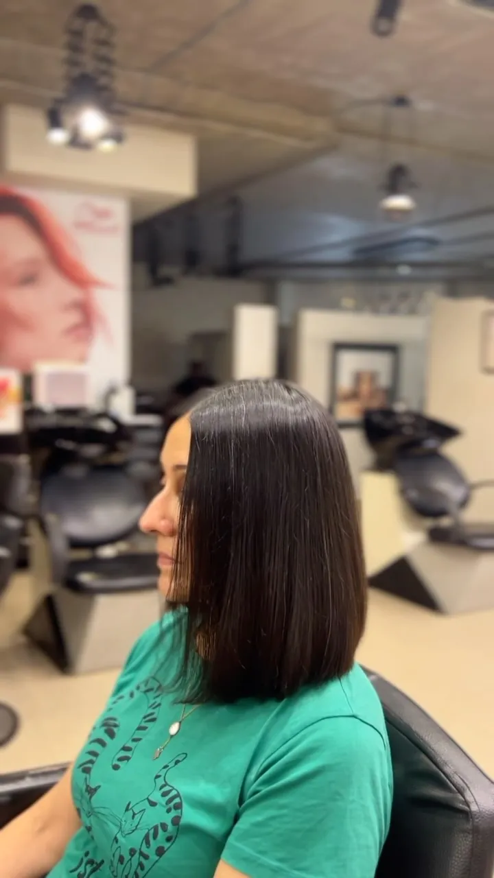 A sleek, glossy shoulder-length bob